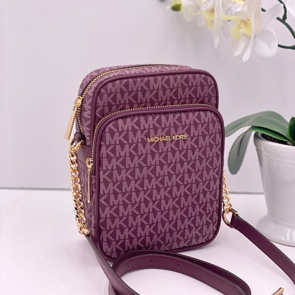 Michael Kors Handbags - Michael Kors Jet Set Travel Medium
Logo Crossbody Bag